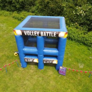 Blue inflatable "Volley Battle" game structure set up on a grassy field.